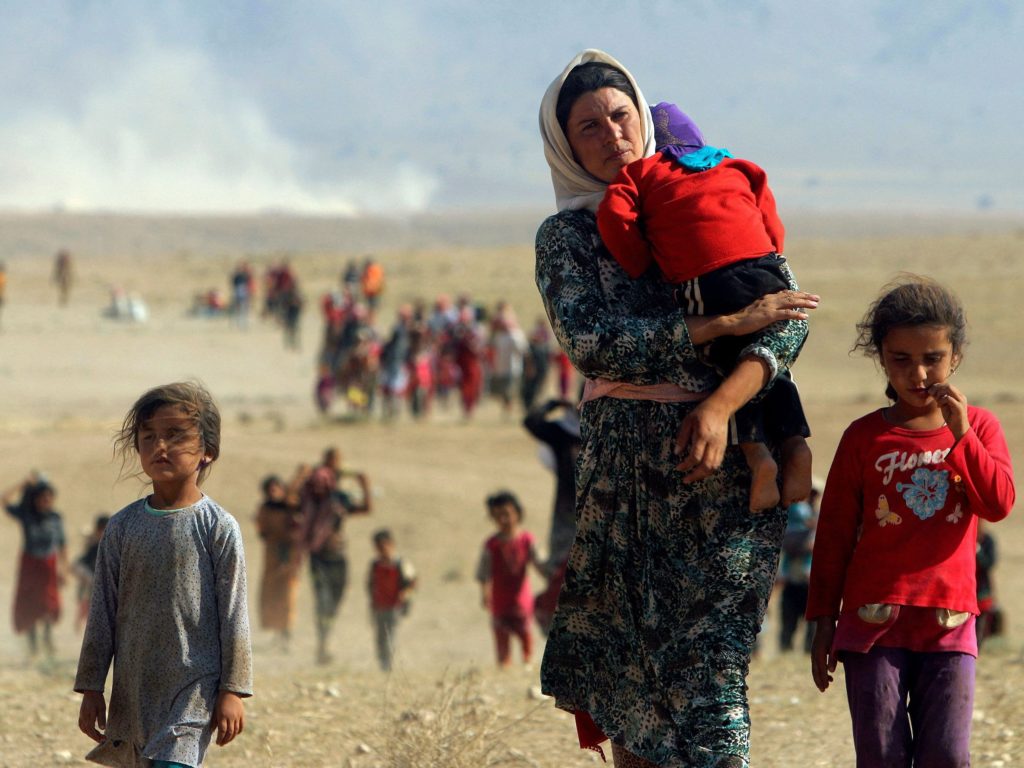 Тысячи езидов были вынуждены бежать от джихадистов в горы в августе 2014 года.
Роди Саид / Reuters
